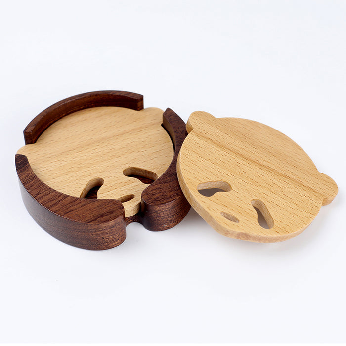 Handcrafted Panda Coaster Set with Stand: light natural wood, dark brown wood animal-like character shapes, minimal cartoon s