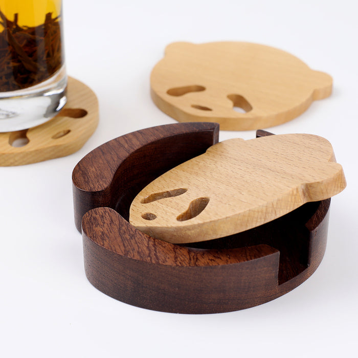 Handcrafted Panda Coaster Set with Stand: light natural wood, dark brown wood animal-like character shapes, minimal cartoon s