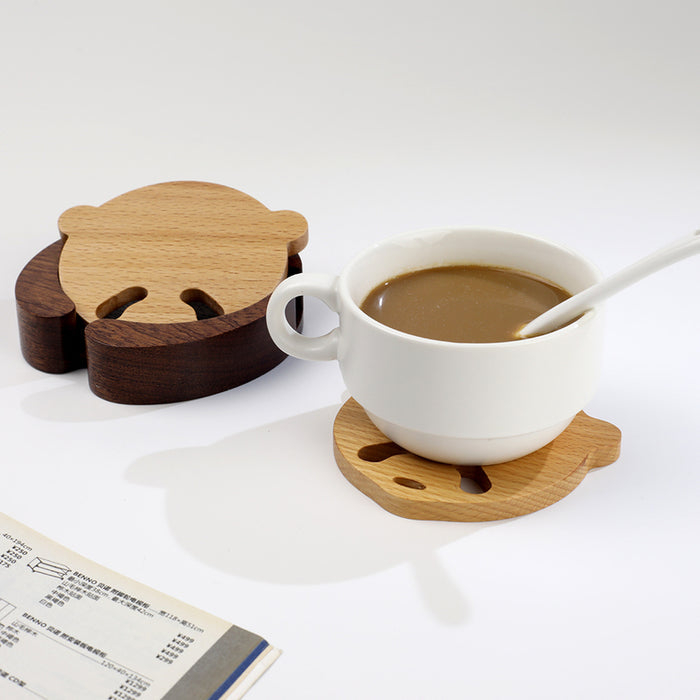 Handcrafted Panda Coaster Set with Stand: light natural wood, dark brown wood animal-like character shapes, minimal cartoon s