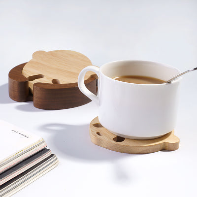 Handcrafted Panda Coaster Set with Stand: light natural wood, dark brown wood animal-like character shapes, minimal cartoon s