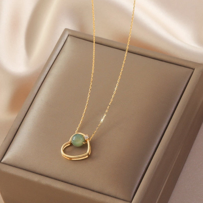 Heart of Gold: A Radiant Jade Necklace with a Touch of Elegance: gold, pale green pendant necklace, minimal style