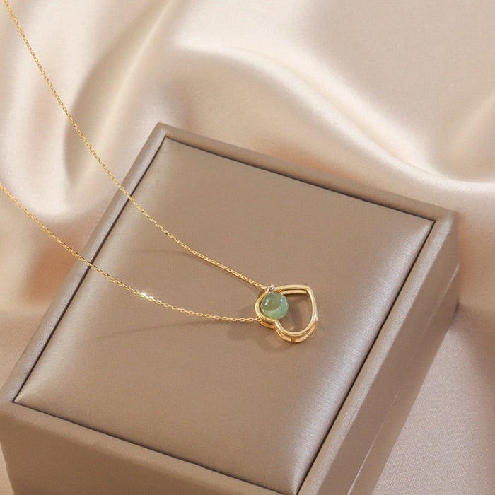 Heart of Gold: A Radiant Jade Necklace with a Touch of Elegance: gold, pale green pendant necklace, minimal style