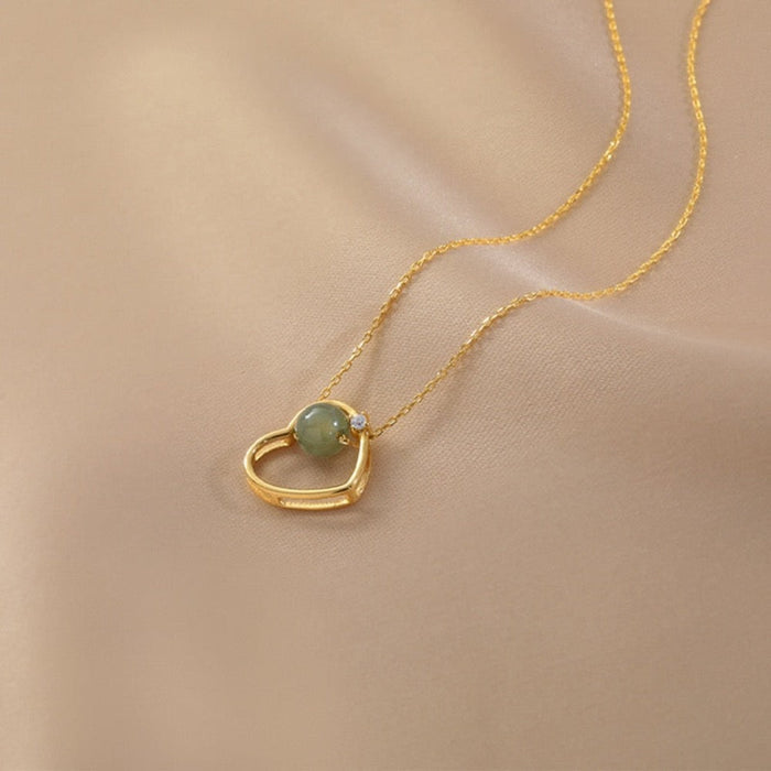 Heart of Gold: A Radiant Jade Necklace with a Touch of Elegance: gold, pale green pendant necklace, minimal style