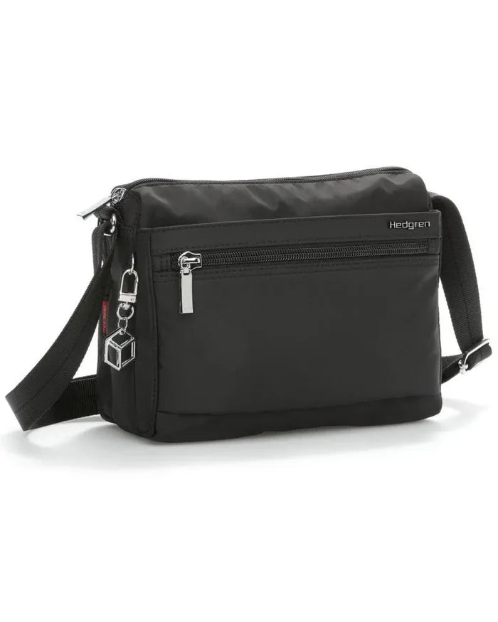 Black hedgren eye crossbody bag with silver zippers, cube keychain, and adjustable shoulder strap for easy wear