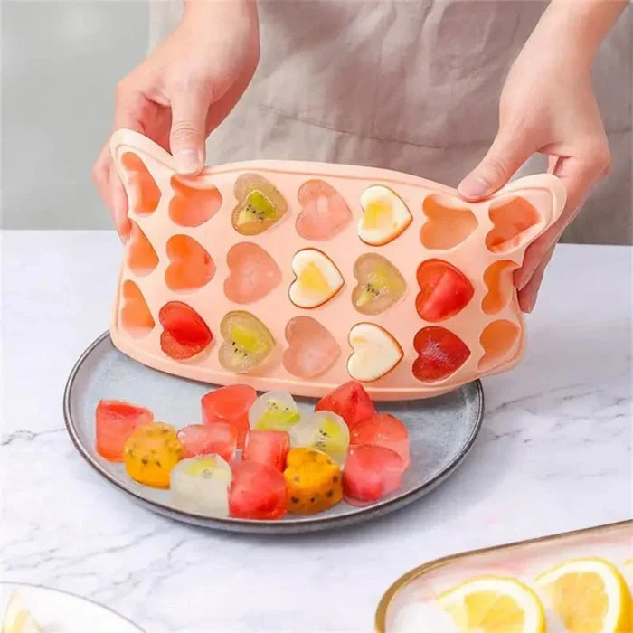 Ice Mold in the Shape of a Heart: peach pink, orange heart-shaped ice cube mold tray, minimal style