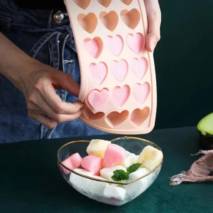 Ice Mold in the Shape of a Heart: peach pink, orange heart-shaped ice cube mold tray, minimal style