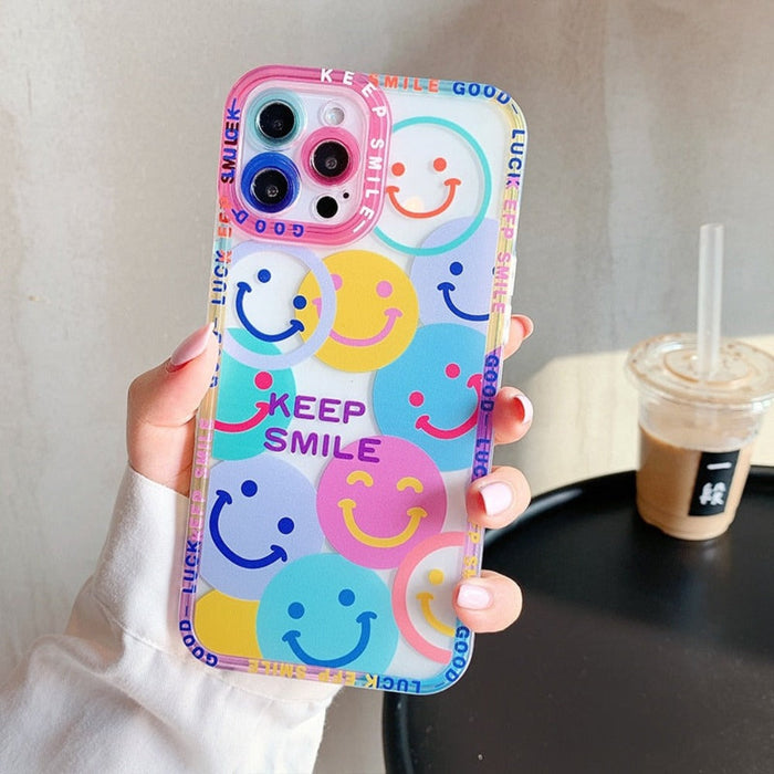 iPhone Case with a Happy Face Design: clear, pink smiley face theme, kawaii cartoon style