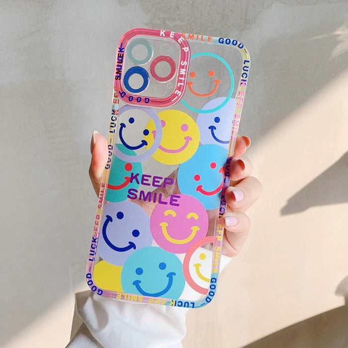 iPhone Case with a Happy Face Design: clear, pink smiley face theme, kawaii cartoon style