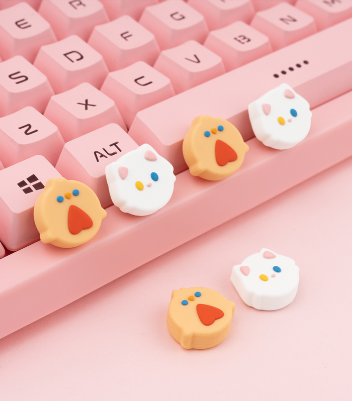 Kawaii Animal Design Switch Thumb Grips: pink, white cartoon animal faces, kawaii cartoon style