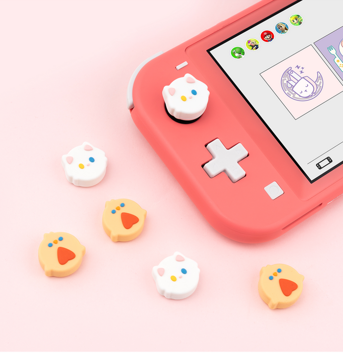 Kawaii Animal Design Switch Thumb Grips: pink, white cartoon animal faces, kawaii cartoon style
