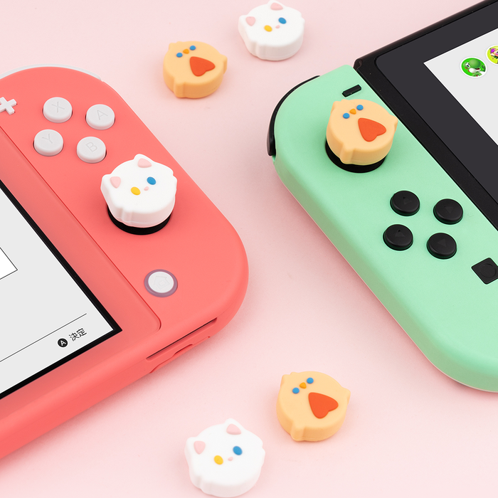 Kawaii Animal Design Switch Thumb Grips: pink, white cartoon animal faces, kawaii cartoon style