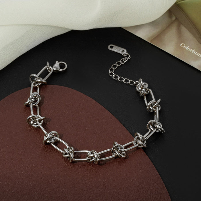 Knot-Embellished Chain Link Bracelet: gold bracelet, minimal style
