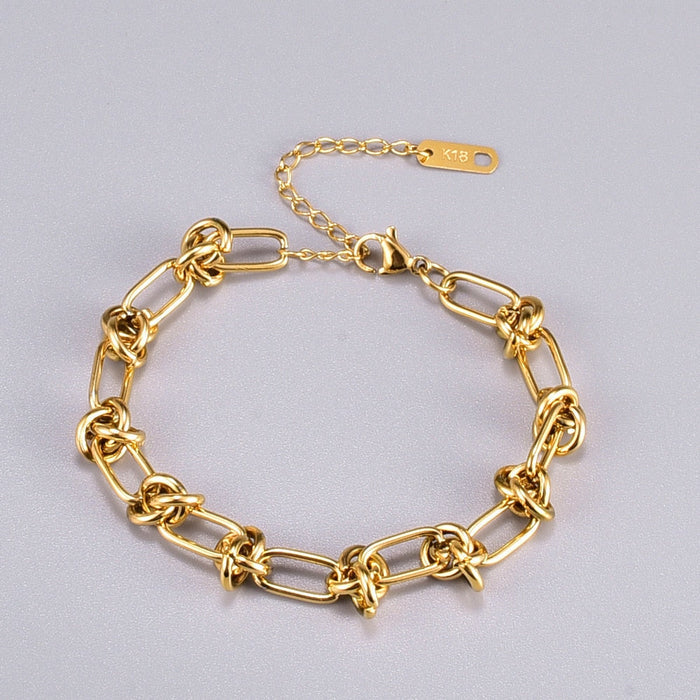 Knot-Embellished Chain Link Bracelet: gold bracelet, minimal style