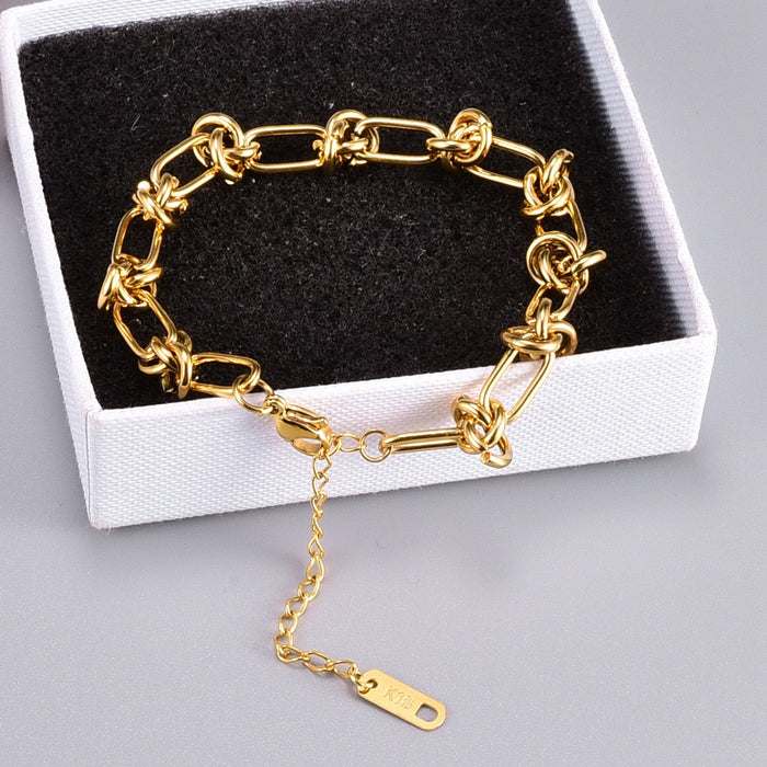 Knot-Embellished Chain Link Bracelet: gold bracelet, minimal style
