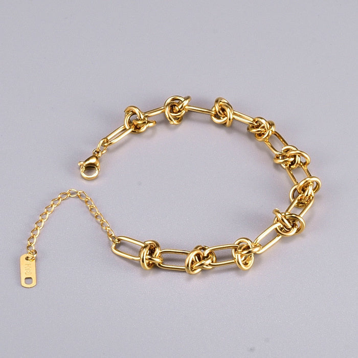 Knot-Embellished Chain Link Bracelet: gold bracelet, minimal style