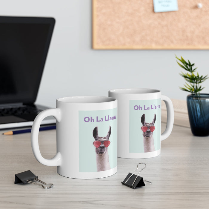 La Llama Oh Mug: white, light blue llama, cartoon-like novelty graphic style