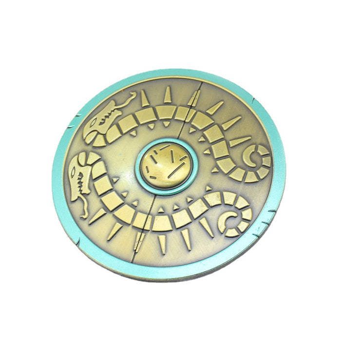 Legend of Zelda Traveler's Shield Metal Model: turquoise, gold centipede-like creature, stylized fantasy cartoon style