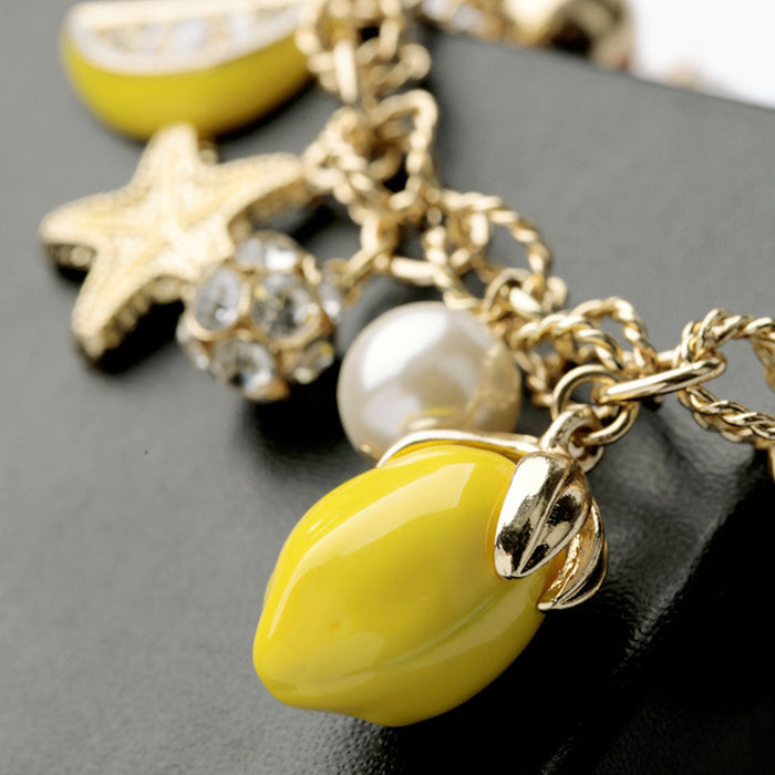 Lemon and Starfish Chain Bracelet: gold, yellow starfish and citrus fruit theme, playful nautical summer charm jewelry style