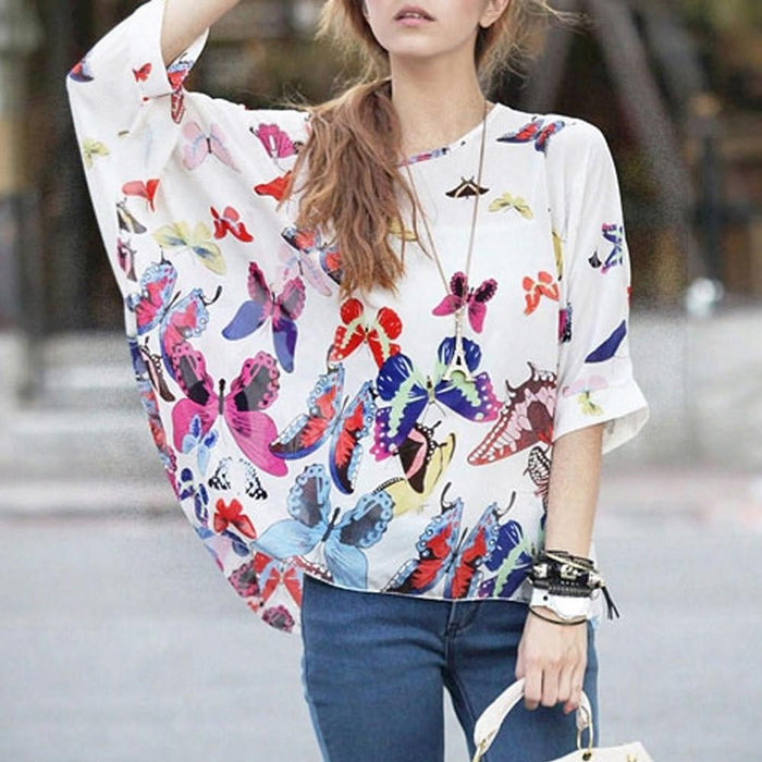 Loose-Fitting Women's Top with Butterfly Design: white, blue butterflies and floral/botanical motifs, casual bohemian graphic