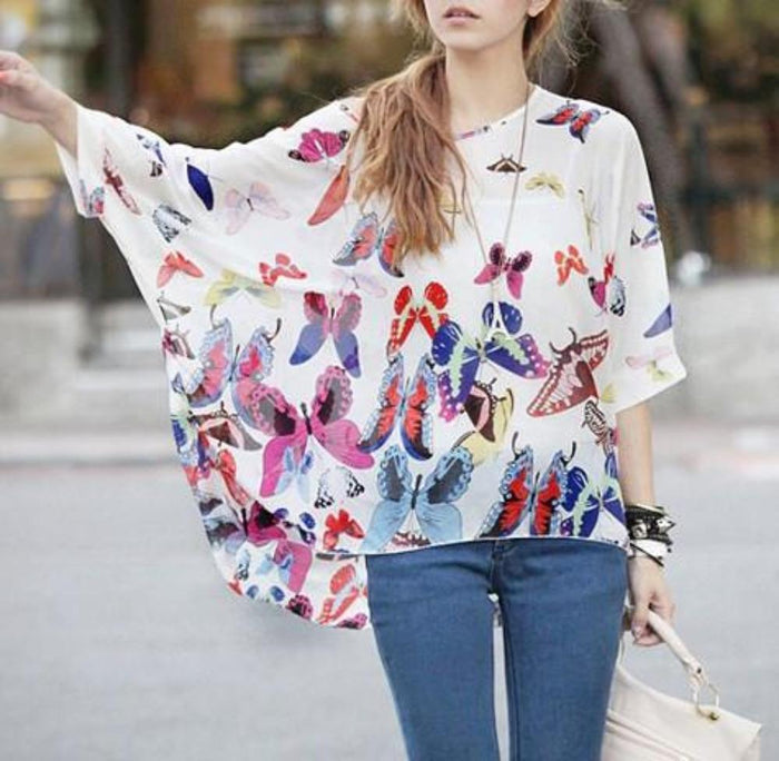 Loose-Fitting Women's Top with Butterfly Design: white, blue butterflies and floral/botanical motifs, casual bohemian graphic