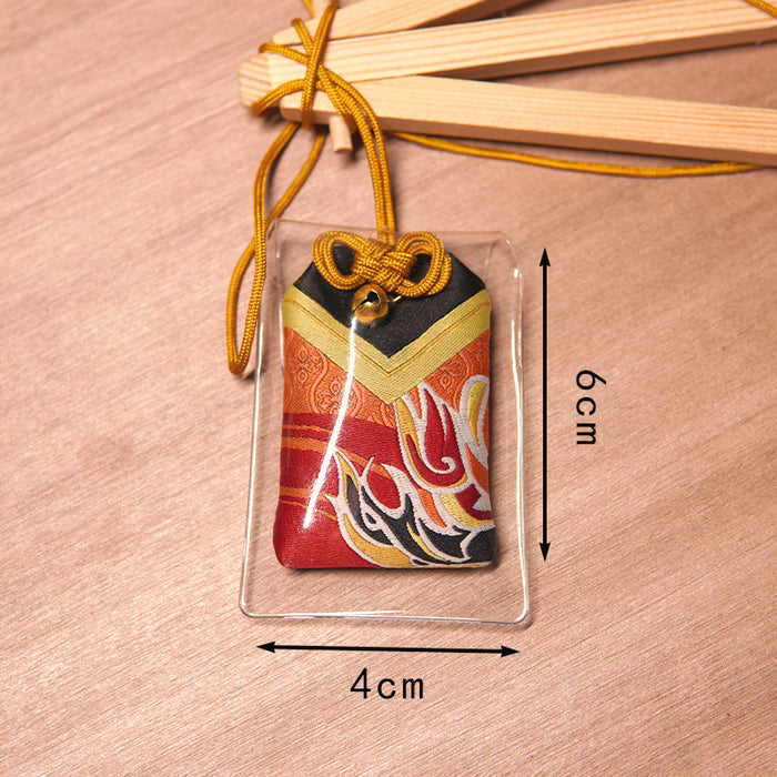 Lucky Omamori, Genshin Impact Quest Item: red, gold decorative drawstring pouch ornament on a small wooden easel, traditional