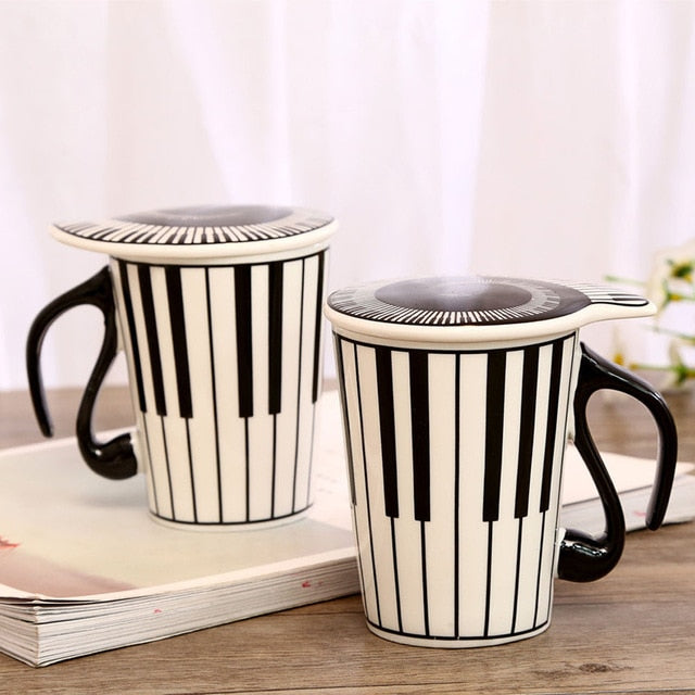 Musical Inspiration Ceramic Coffee Mug with Piano Lid: cream white, black musical notation theme, music-themed graphic style