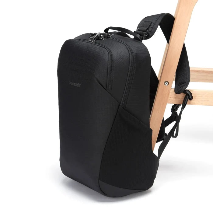 Pacsafe Vibe 20 anti-theft backpack tethered with security cable