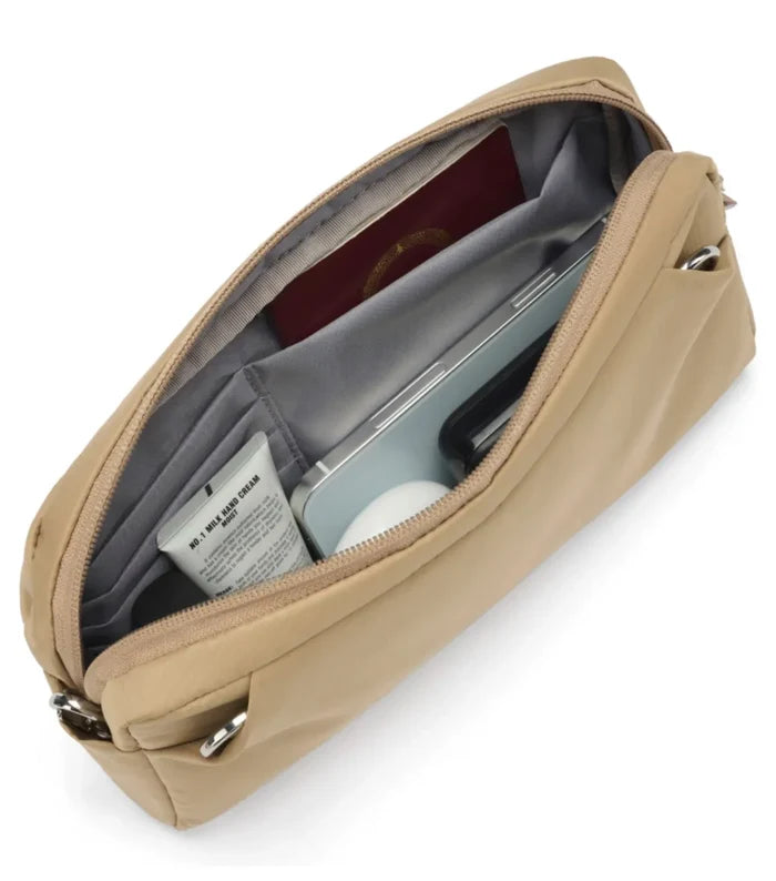 Beige nylon travel toiletry bag with gray interior and silver zippers made with cut-resistant materials in taupe sling pack