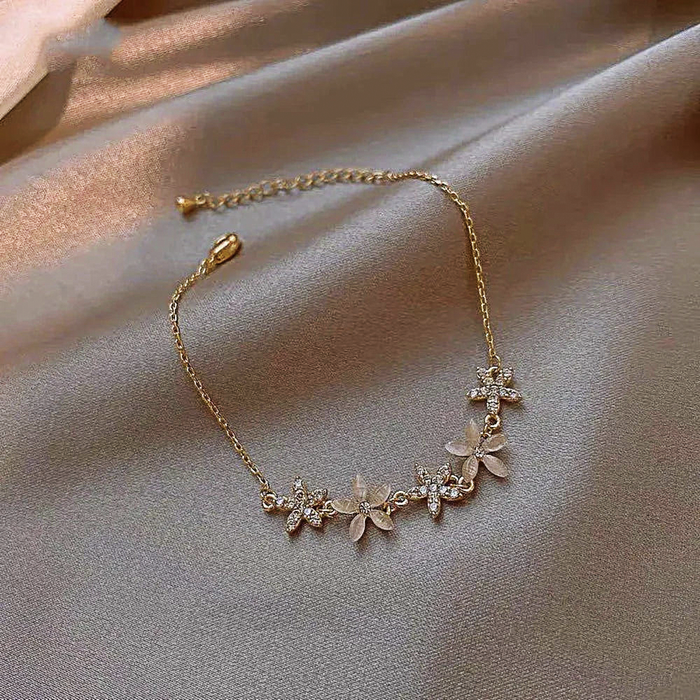 Petal Blossom Wristlet: gold, clear floral, delicate, feminine, floral style