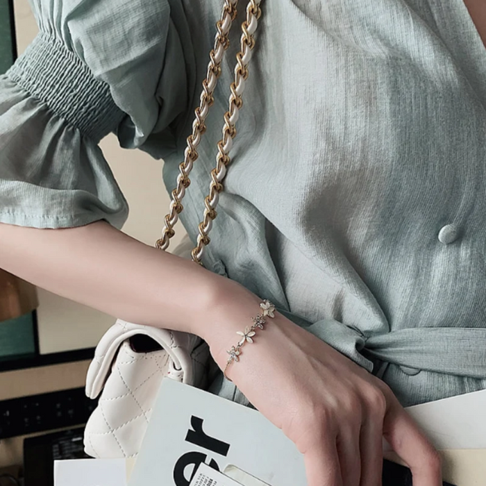 Petal Blossom Wristlet: gold, clear floral, delicate, feminine, floral style