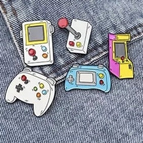 Retro Games Pins: Fun & Fashionable Arcade Nostalgia: white, gray retro video game controllers and handheld consoles, cartoon