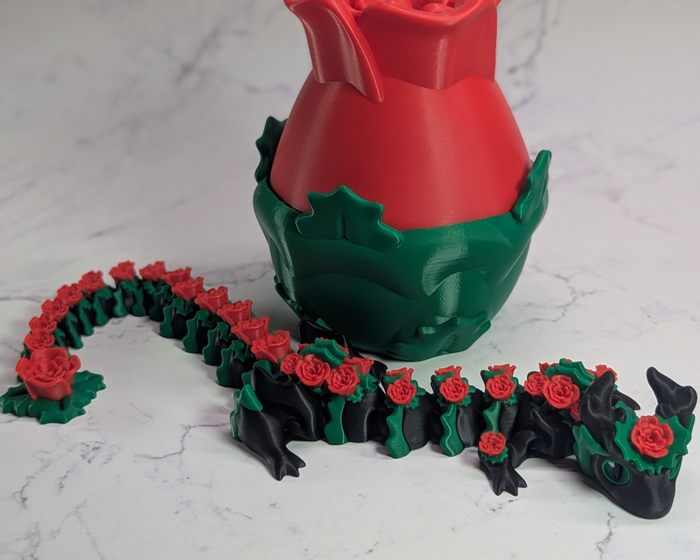 Rose Dragon Laying In Front Of Egg