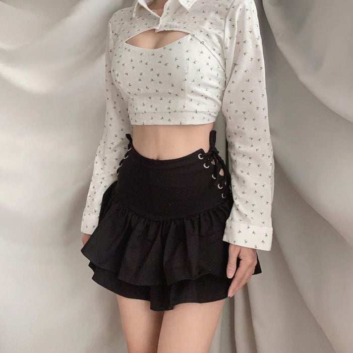 Ruffled Layered Mini Skirt: black two-piece black outfit with long-sleeve cutout top and layered ruffle skirt/shorts, gothic
