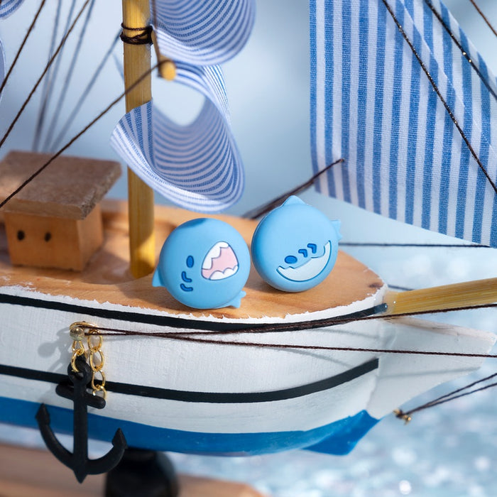 Sea Creature Switch Thumb Grips with Joystick Caps: light blue, white cartoon shark faces, cartoon, kawaii style