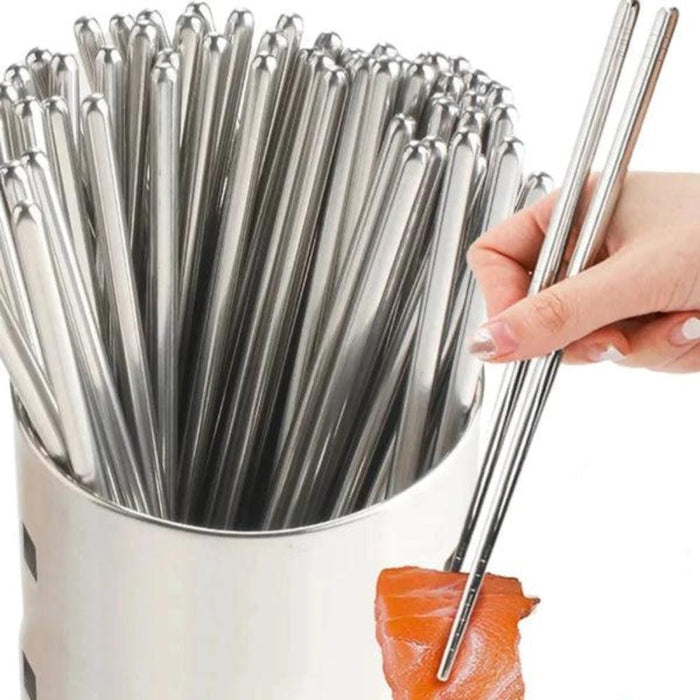 Set of 5 Pairs of Stainless Steel Chopsticks from Korea: golden brown, brown plate of stir-fried noodles, food photography st