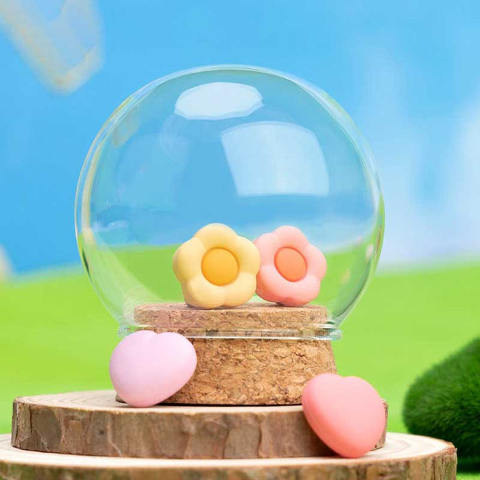 Silicone Switch Thumb Grips with Designs: pastel pink, pastel yellow soft cushion-like objects, minimal pastel style