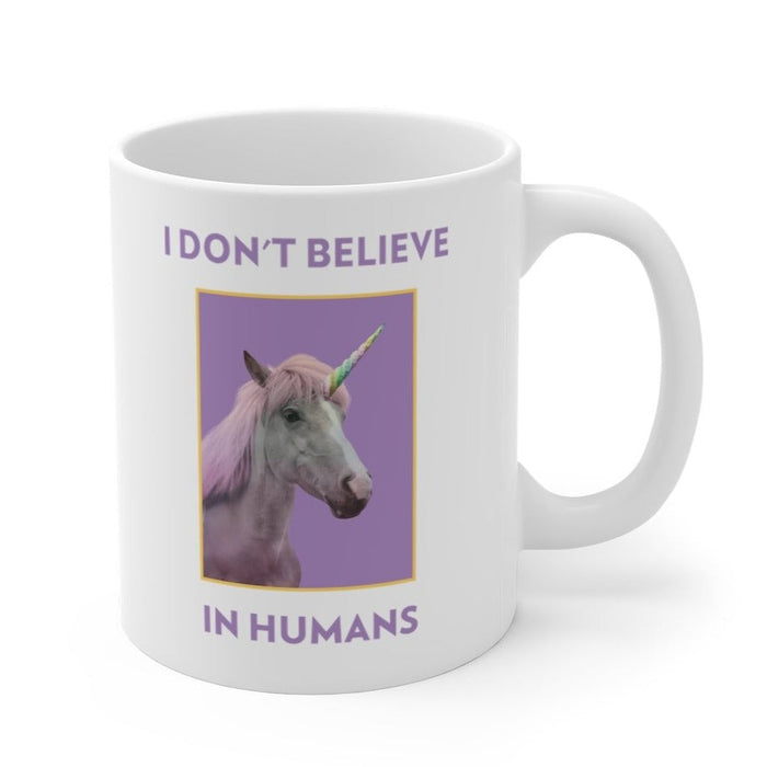 Skeptic Mug: Humans Are Not Real: white, purple unicorn, cartoon novelty style