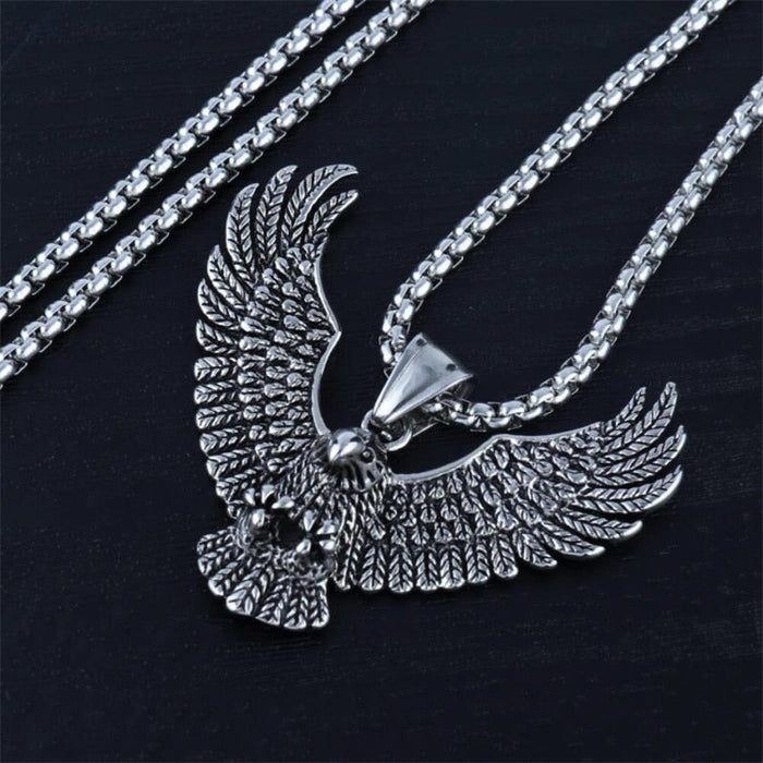 Soaring Falcon Pendant: silver, dark gray eagle, ornate realistic animal motif style