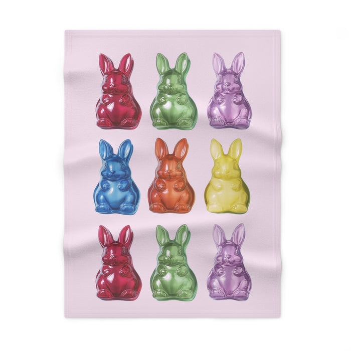 Soft Pink Fleece Baby Blanket with Bunny-Shaped Gummies: pale pink, red rabbits, cartoon-like glossy figurine illustration st