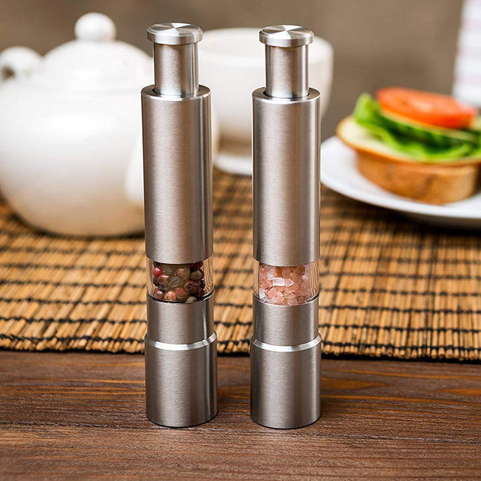 Stainless Steel Deluxe Salt and Pepper Spice Mill: brown, beige plated meal with steak and pasta, food photography style