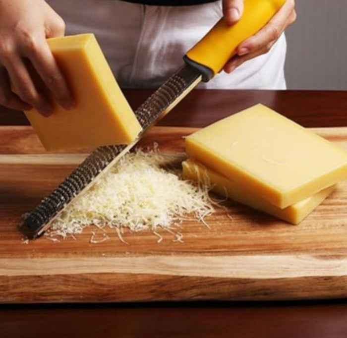 Stainless Steel Multi-Purpose Fruit and Cheese Peeler: silver, black handheld grater/zester, minimal kitchen utensil product
