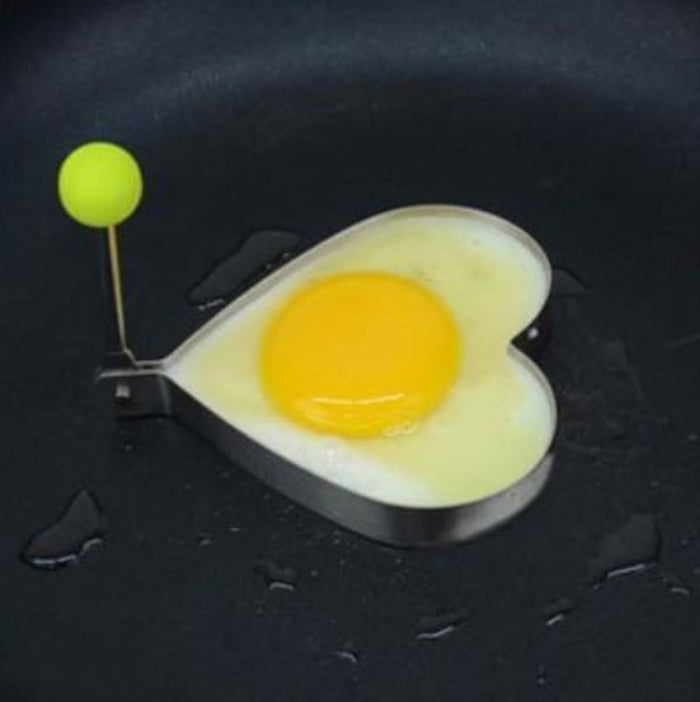 Stainless Steel Pancake Shaping Mold Set, 4 Pieces: white, yellow-orange fried egg on toast, food photography style