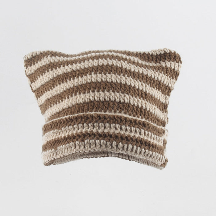 Striped Knitted Beanie for Adults: black, white cat-like character, minimal cartoon style