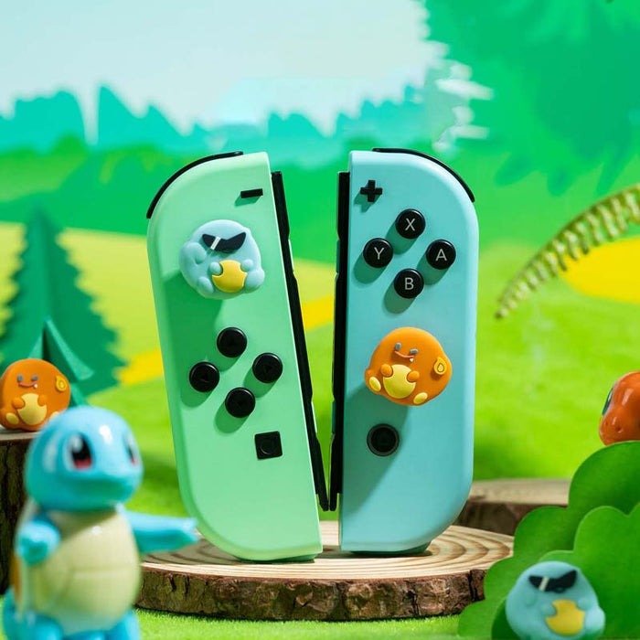 Switch Anime Thumb Grips with Personality: mint green, light blue Pokémon-themed, with visible Squirtle and Snorlax-like char
