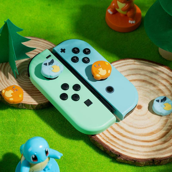 Switch Anime Thumb Grips with Personality: mint green, light blue Pokémon-themed, with visible Squirtle and Snorlax-like char