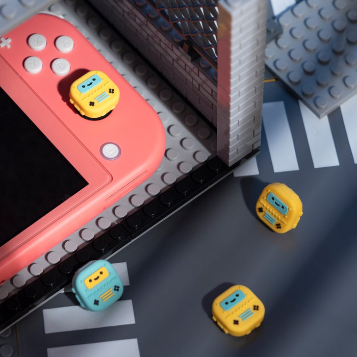 Switch Robot Thumb Grips for Gamers: mint green, teal handheld game controller with detachable side controllers, kawaii carto
