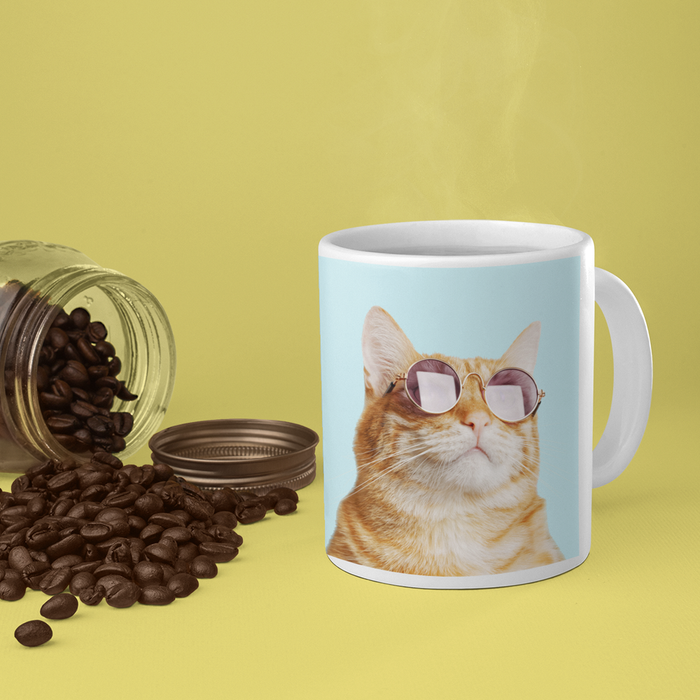 The Purrfect Mug for Cat Lovers: white, light blue orange tabby cat wearing sunglasses, playful photo print style