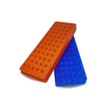 Two plastic tube holders, one orange and one blue, each with multiple holes designed to hold laboratory tubes.
