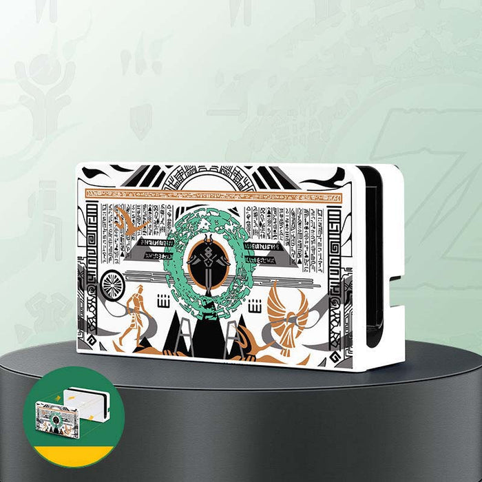 Zelda TOTK Switch Charging Dock Cover: white, black Egyptian-inspired pharaoh/anubis-style figure and hieroglyphic theme, gra